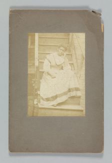 Albumen print of an unidentified woman sitting on stairs, 1850-1895. Creator: Unknown