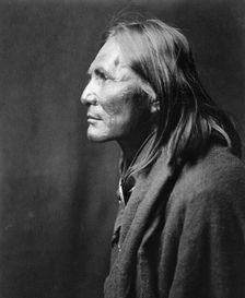 Alchise, Apache Indian, half-length portrait, left profile, c1906. Creator: Edward Sheriff Curtis