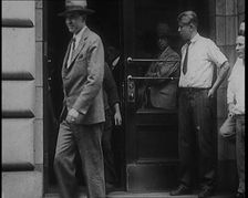 Alcohol Smugglers Coming Out of Court, 1929. Creator: British Pathe Ltd