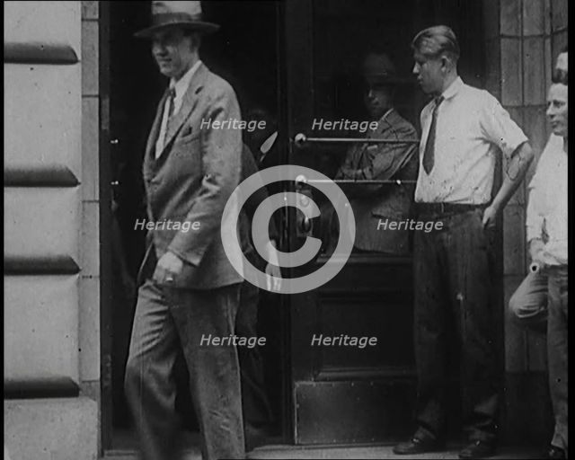 Alcohol Smugglers Coming Out of Court, 1929. Creator: British Pathe Ltd.