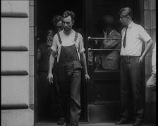 Alcohol Smugglers Coming Out of Court, 1929. Creator: British Pathe Ltd