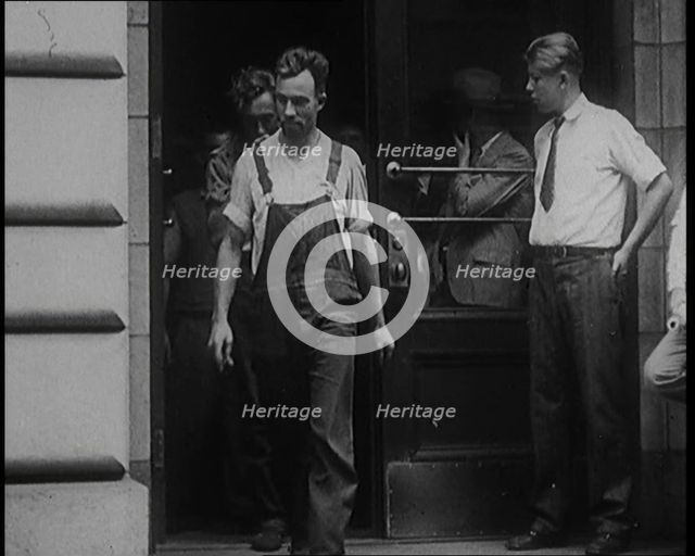 Alcohol Smugglers Coming Out of Court, 1929. Creator: British Pathe Ltd.