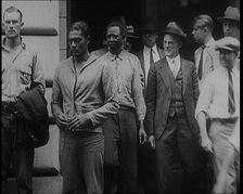 Alcohol Smugglers Coming Out of Court, 1929. Creator: British Pathe Ltd