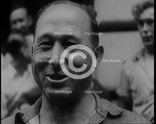 Alcohol Smugglers Coming Out of Court, 1929. Creator: British Pathe Ltd.
