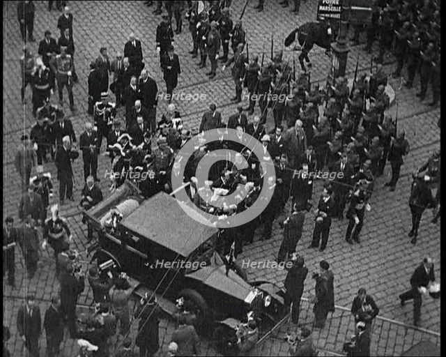 Alexander I, His Majesty the King of Yugoslavia Entering a Car, Surrounded by a Crowd, 1934. Creator: British Pathe Ltd.