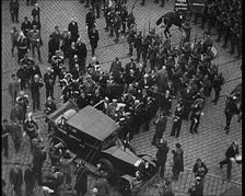 Alexander I, His Majesty the King of Yugoslavia Entering a Car, Surrounded by a Crowd, 1934. Creator: British Pathe Ltd