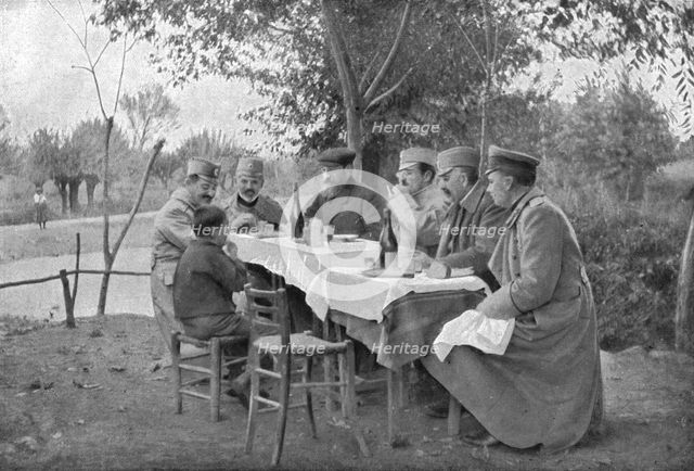 'Alexandre de Serbie au front de Monastir; Le prince Alexandre a fait asseoir a sa table,dresse en p Creator: Vladimir Betzitch.