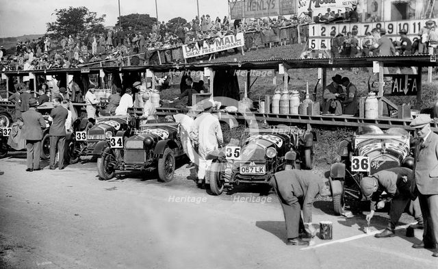Alfa Romeos in the pits at the RAC TT Race, Ards Circuit, Belfast, 1929 Artist: Bill Brunell.