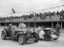Alfa Romeo and supercharged MG Midget on the start line at Brooklands, 1938 or 1939. Artist: Bill Brunell