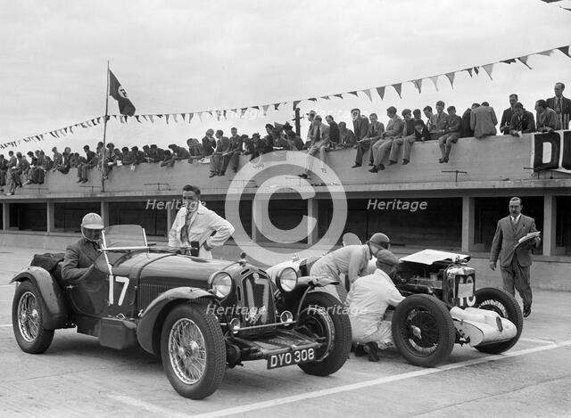 Alfa Romeo and supercharged MG Midget on the start line at Brooklands, 1938 or 1939. Artist: Bill Brunell.