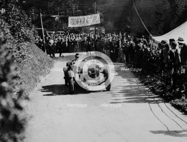 Alfa Romeo competing in the Shelsley Walsh Amateur Hillclimb, Worcestershire, 1929. Artist: Bill Brunell.