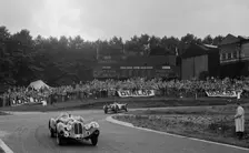 Alfa Romeo of Hugh Hunter leading a Riley at Crystal Palace, London, 1939. Artist: Bill Brunell