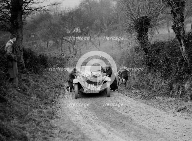 Alfa Romeo of KD Evans getting a push at the NWLMC London-Gloucester Trial, 1931. Artist: Bill Brunell.