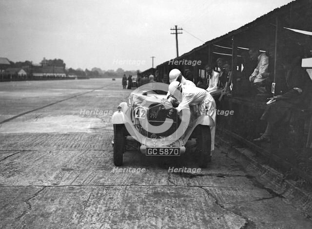 Alfa Romeo of KD Evans in the pits at the JCC Members Day, Brooklands, 4 July 1931. Artist: Bill Brunell.