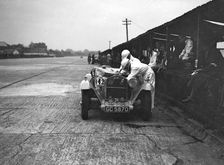 Alfa Romeo of KD Evans in the pits at the JCC Members Day, Brooklands, 4 July 1931. Artist: Bill Brunell