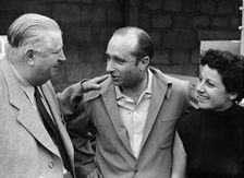 Alfred Neubauer with Juan Manuel Fangio and his wife, c1954-c1955