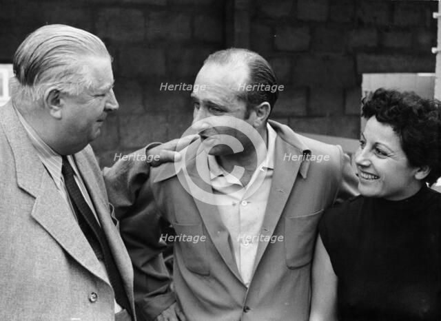 Alfred Neubauer with Juan Manuel Fangio and his wife, c1954-c1955. Artist: Unknown