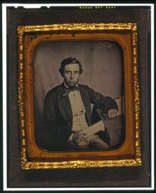 Alfred Francis Russell, three-quarter length portrait, full face, seated..., between 1856 and 1858. Creator: Augustus Washington