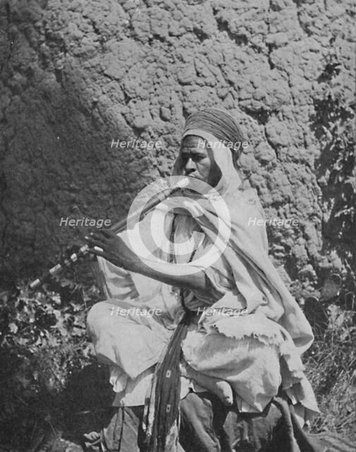 Algerian native flute player, 1912. Artist: Unknown.