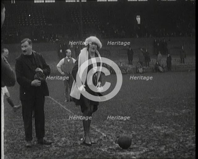 Alice Delysia Kicking Off a Men's Football Match, 1920. Creator: British Pathe Ltd.