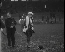 Alice Delysia Kicking Off a Men's Football Match, 1920. Creator: British Pathe Ltd