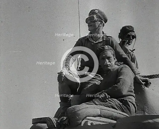 Allied Soldiers Riding a Tank, 1942. Creator: British Pathe Ltd.