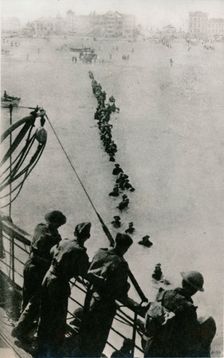 Allied troops wait for a ship during the Dunkirk evacuation, 1940. Creator: Unknown