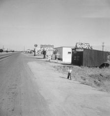 Along the highway U.S. 99 at Highway City, between Tulare and Fresno, California, 1939. Creator: Dorothea Lange