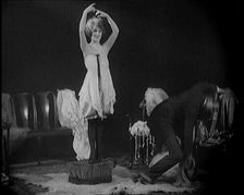 Alphonse Berge, Famous Fashion Designer, Constructing a Dress, a Female Civilian Model..., 1920. Creator: British Pathe Ltd
