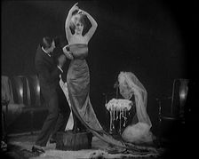 Alphonse Berge, Famous Fashion Designer, Constructing a Dress, a Female Civilian Model..., 1920. Creator: British Pathe Ltd