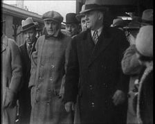 Alphonse Gabriel Capone AKA Al Capone Being Escorted by a Group of Male American Civilians...1930. Creator: British Pathe Ltd