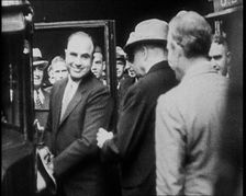 Alphonse Gabriel Capone AKA Al Capone Entering a Car Watched by a Small Crowd, 1930. Creator: British Pathe Ltd