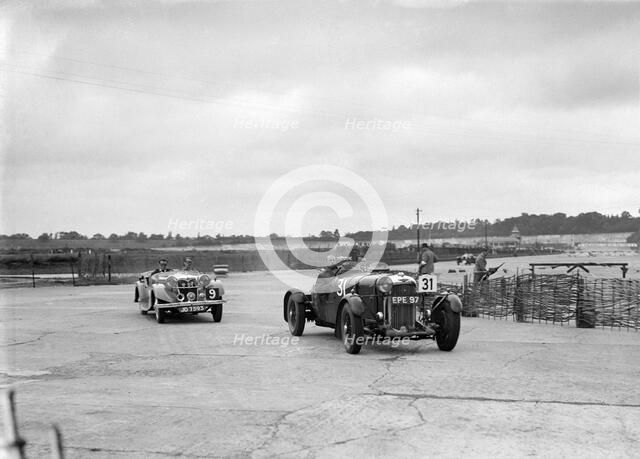 AP Watson's Lagonda and AS Lusty's Riley Lynx at the chicane, JCC Members Day, Brooklands, 1939. Artist: Bill Brunell.