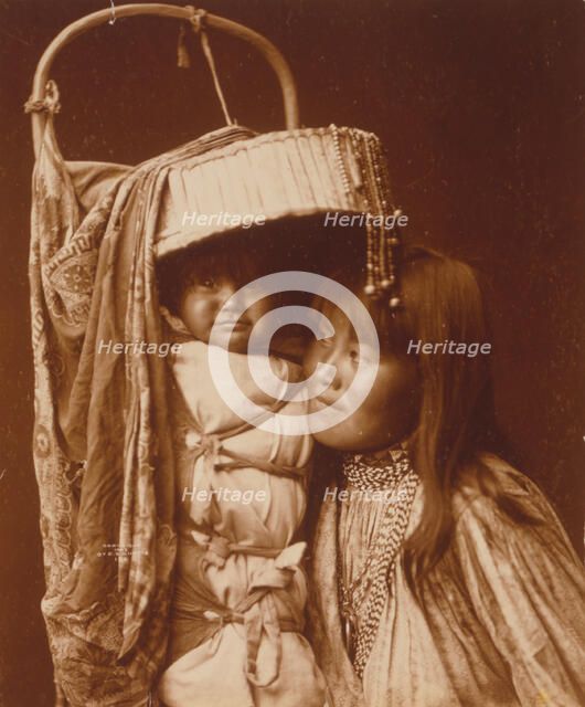 Apache girl and papoose, c1903. Creator: Edward Sheriff Curtis.