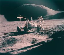 Apollo 15 astronaut James Irwin with the Lunar Rover, August 1971. Creator: Unknown