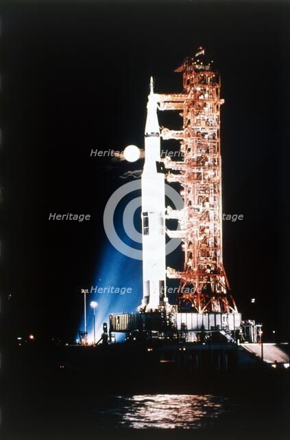 Apollo 9 Saturn V rocket with full moon, 1969.  Creator: NASA.