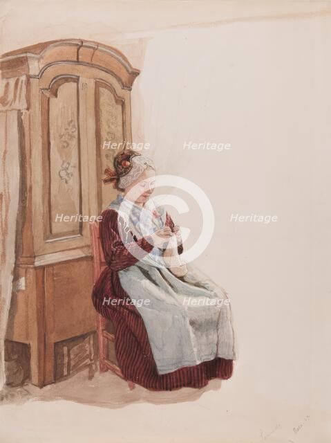 Apparel - Handicraft woman in full figure sitting in front of a cupboard. (c1900s). Creator: AJG Virgin.