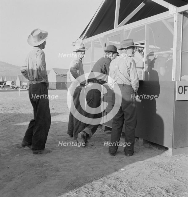 Applicants at registration tent on opening day...FSA camp, Merrill, Klamath County, Oregon, 1939. Creator: Dorothea Lange.