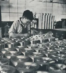 Apprentice with microscope (testing the hardness of pistons) 1941. Artist: Cecil Beaton