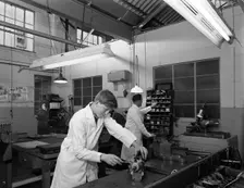 Apprentice at work, Globe & Simpson auto electrical workshop, Nottingham, Nottinghamshire, 1961. Creator: Michael Walters