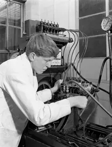 Apprentice at work, Globe & Simpson auto electrical workshop, Nottingham, Nottinghamshire, 1961. Creator: Michael Walters