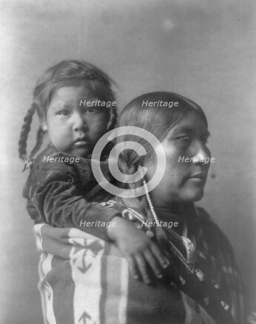 Apsaroke mother, c1908. Creator: Edward Sheriff Curtis.