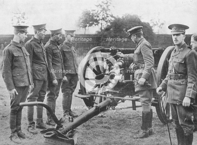 'Artillery recruits having the mechanism of an 18-pounder explained to them', 1915. Artist: Unknown.