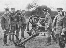 Artillery recruits having the mechanism of an 18-pounder explained to them 1915