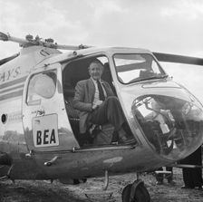 Artist Terence Cuneo in a BEA helicopter, London to Yorkshire Motorway, 10/1958. Creator: John Laing plc