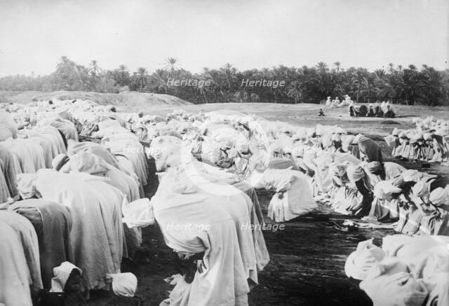 Arabs at prayer in desert, between c1910 and c1915. Creator: Bain News Service.