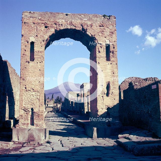 Arch of Caligula with Vesuvius beyond, Pompeii, Italy. Creator: Unknown.