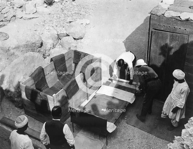 Archaeologists working  at the Tomb of Tutankhamun, Valley of the Kings, Egypt, 1922. Artist: Harry Burton