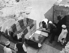 Archaeologists working at the Tomb of Tutankhamun, Valley of the Kings, Egypt, 1922. Artist: Harry Burton