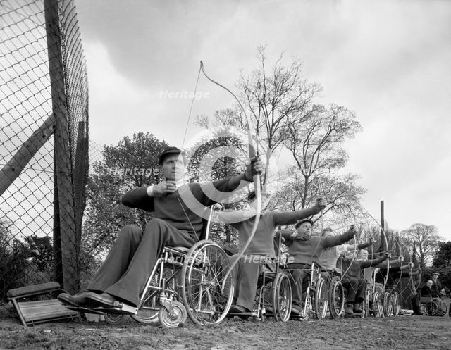 Archery practice at the CISWO paraplegic centre, Pontefract, West Yorkshire, 1960. Creator: Michael Walters.